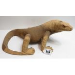 A large carved wooden figure of a lizard 15cms high