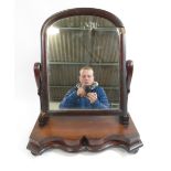 A Victorian mahogany dressing mirror on shaped base together with a Canadian maple chopping board