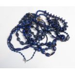 Eight lapis lazuli polished bead necklaces of varying design, with interval beads to include