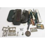 A quantity of assorted fountain and other pens, some early spectacles, paste set buckles and other