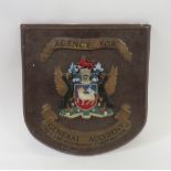 An early 20th Century General Accident Agency wall shield, painted composition, 41cms high x 39cms