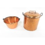 A Victorian copper stock pot with lid and iron side handles, pan 23cms high together with a