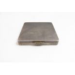 An Asprey & Co Ltd silver compact, Birmingham 1960, of square outline with a gold chased thumbpiece,