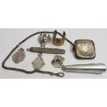 A silver cigarette holder case, silver vesta case on chain; silver medallions; silver cased