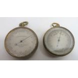 A pocket barometer in circular brass case with revolving outer dial, silvered metal Rain Fair" 4.