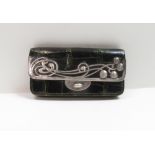 An Art Nouveau silver mounted leather purse, Birmingham 1902, letter F for Foreign import, and