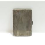 A silver cigarette case, inscribed and monogrammed, 206 g (6.6 troy ozs) gross