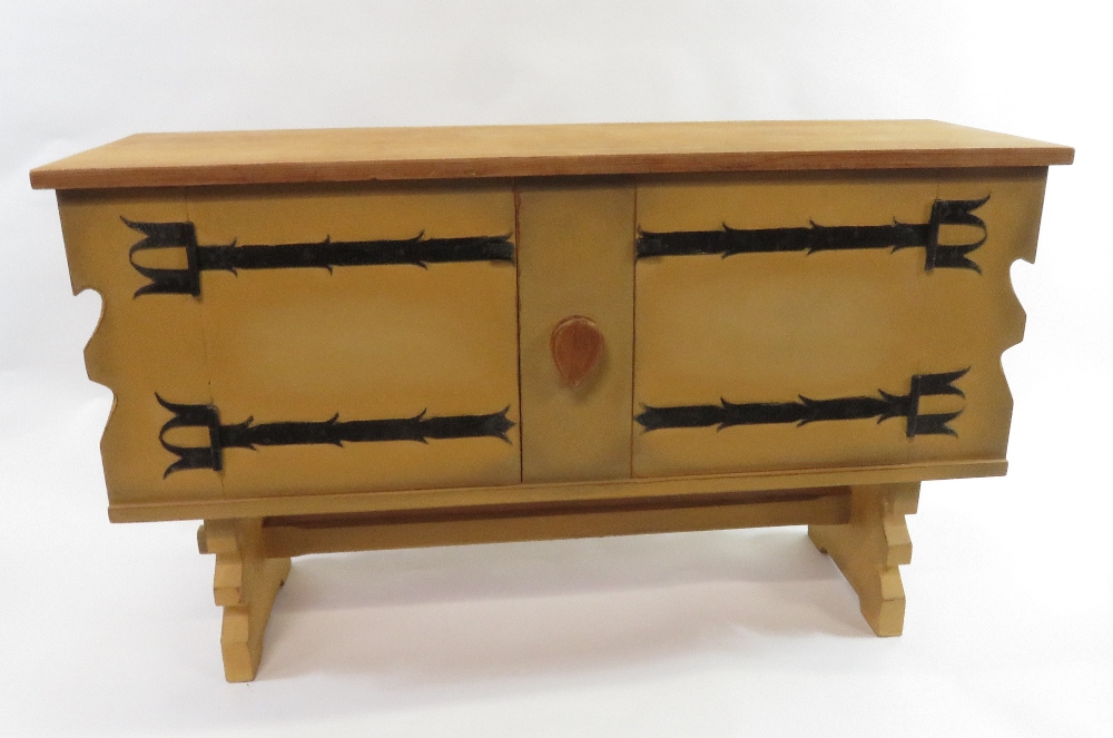 A Scandinavian style painted pine sideboard the two doors with decorative painted metal hinges,