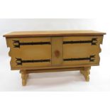A Scandinavian style painted pine sideboard the two doors with decorative painted metal hinges,