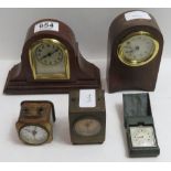 Two small 30hr wooden desk clocks, together with two early brass cased travelling alarm clocks, a