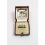 A ruby and diamond ring, stamped '18ct Plat', finger size N, 1.7 g gross, cased
