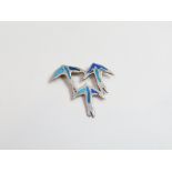 A silver and enamel brooch designed as a trio of stylised swallows in flight, stamped 'HAF', '1992',