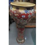 A late Victorian Japanese Satsuma jardiniere on matching stand, painted with coloured enamels with