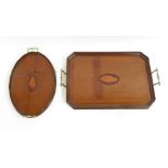 An early 19th Century inlaid mahogany oval tray with brass handles 43cms wide together with a