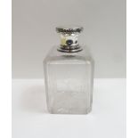 A French silver mounted glass scent bottle of fairly large size, the neck and pull off cover with