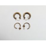 A pair of 9 carat gold hoop earrings, 0.6 g gross; with another pair of hoop earrings
