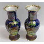 A pair of Carlton Ware lustre glazed vases, with Chinoiserie style decoration on a deep blue