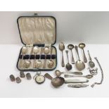 A cased set of six silver tea spoons; a Georgian style silver caddy spoon; three antique silver