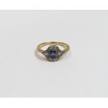 A sapphire and diamond ring, worn mark, circa 1935, the square cut stone with two Swiss cut diamonds