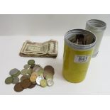A large quantity of assorted coins contained in two metal cannisters, mainly pennies and brass