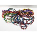 A quantity of costume jewellery bead necklaces, largely glass beads; of varying colours, designs and