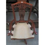 A modern Oriental hardwood desk swivel chair with decorative splat back, curved arms, solid seat