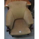 A Georgian style mahogany framed upholstered chair with curved mahogany arms and on rounded front