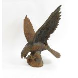 A heavy cast metal figure of an eagle with wings outstretched, 64cms high