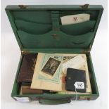 An early 20th century green leather writing case containing a WWI period album of hand written verse