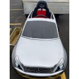 A BRD RACING SIMULATOR IN THE SHAPE OF A MERCEDES WITH A PEDAL BOX
