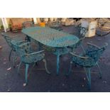 LARGE WEATHERED CAST IRON GARDEN TABLE & 6 MATCHING ARMCHAIRS