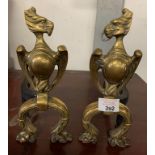 PAIR OF BRASS & IRON FIREDOGS IN THE FORM OF WINGED BEASTS