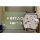 WALL CLOCK IN THE FORM OF A WRIST WATCH WITH A VINTAGE GIFTS WOODEN SIGN