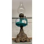 20TH CENTURY OIL LAMP WITH TURQUOISE GLASS RESERVOIR ON METAL BASE