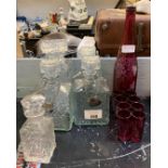 5 GLASS DECANTERS, 3 WITH METAL LABELS, A RUBY BOTTLE WITH ETCHED DECORATION & SIMILAR SHOT GLASSES