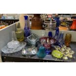 HALF SHELF OF DECORATIVE MID CENTURY GLASS INCLUDING ASHTRAYS, CZECH DECANTERS, MINIATURE ELEPHANTS,