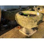 PAIR OF WEATHERED RECONSTITUTED STONE URN PLANTERS