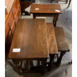 OAK NEST OF TABLES ALONG WITH AN OAK STOOL