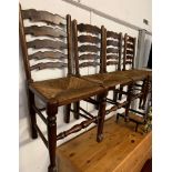 SET OF FOUR OAK FRAMED LADDER BACK DINING CHAIRS WITH RUSH SEATS