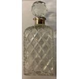 A BROADWAY & CO CUT GLASS DECANTER OF SQUARE FORM WITH STOPPER & SILVER COLLAR IN ORIGINAL BOX