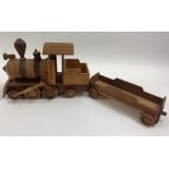 An American style wooden toy steam train and open wagon, 25cm high