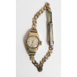Accurist, a lady's 9 carat gold mechanical wrist watch on a metal bracelet