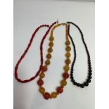Three polished bead necklaces to include garnet, coral and carnelian, various lengths