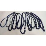 Eight Lapis Lazuli polished bead necklaces of varying design with interval beads to include coral,