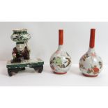 A pair of Chinese bottle vases, painted with birds and flowers, 15.5cm high, together with an