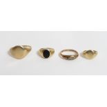 A 9 carat gold signet ring; another similar smaller example; a 9 carat gold onyx signet ring; and