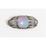 An opal doublet and marcasite set brooch, stamped '935', possibly German, 4.7 cm long by 2.2 cm,