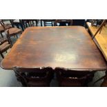 A Victorian mahogany wind out dining table, with carved bulbous legs, along with three additional