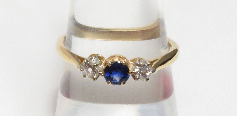 A sapphire and diamond three stone ring, with claw setting, stamped '18ct', size O, 2.3 g gross - Image 4 of 7