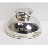 A loaded silver inkwell, by A. L. Davenport, Birmingham 1950, of plain domed form, with a concave